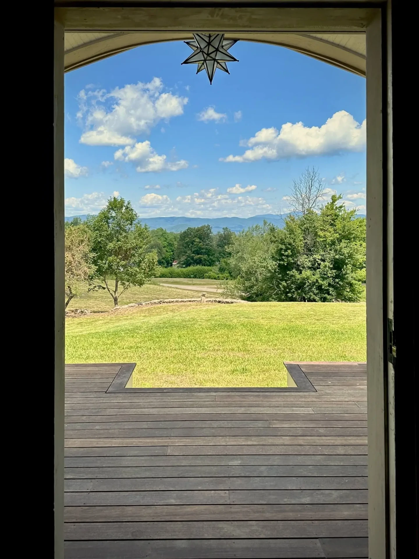 View through a doorway toward the mountain landscape